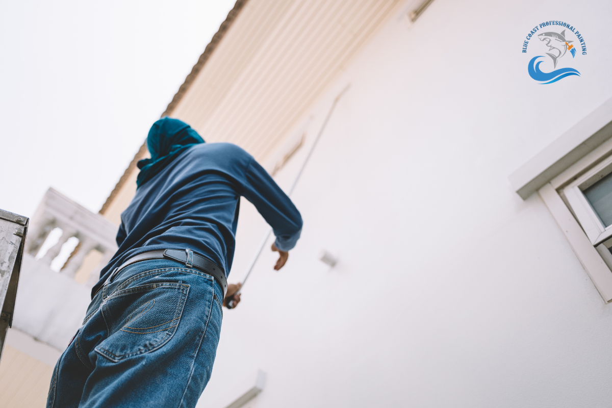 An expert painter painting the exterior of a building in Palos Verdes Peninsula, California.